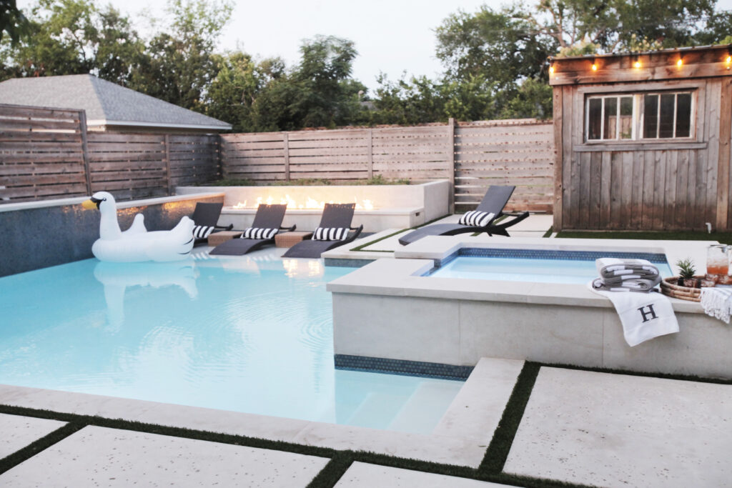 new pool build with modern design elements in fort worth and a fire feature